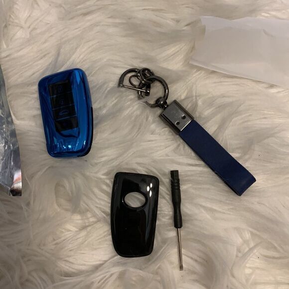 Lexus key fob with three key attached circle connectors for home/office keys. - Picture 1 of 6